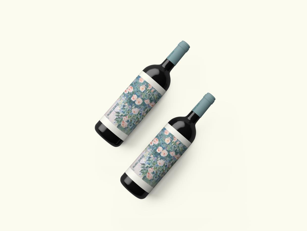 Two wine bottles with blue floral labels
