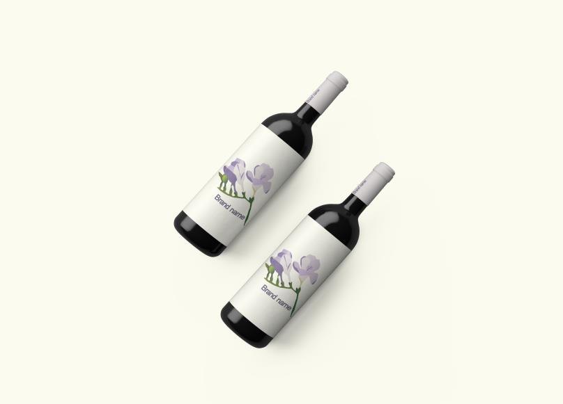 Two wine bottles with violet botanical labels